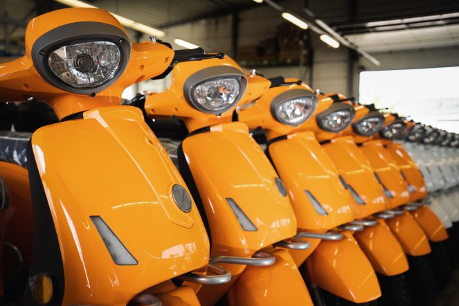A line of mass-produced scooters