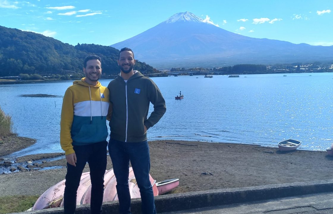 Our dubbing team leaders standing in front of Mountain Fuji