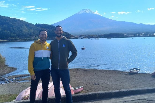 Our dubbing team leaders standing in front of Mountain Fuji